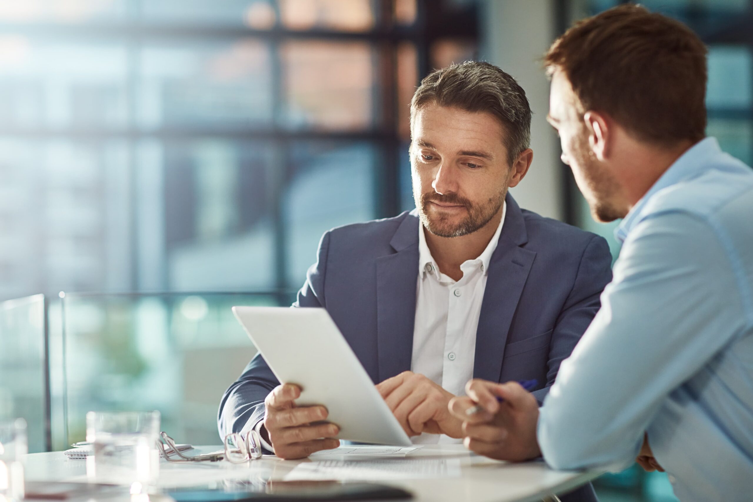 SAP Managed Services Two men looking at something on a tablet